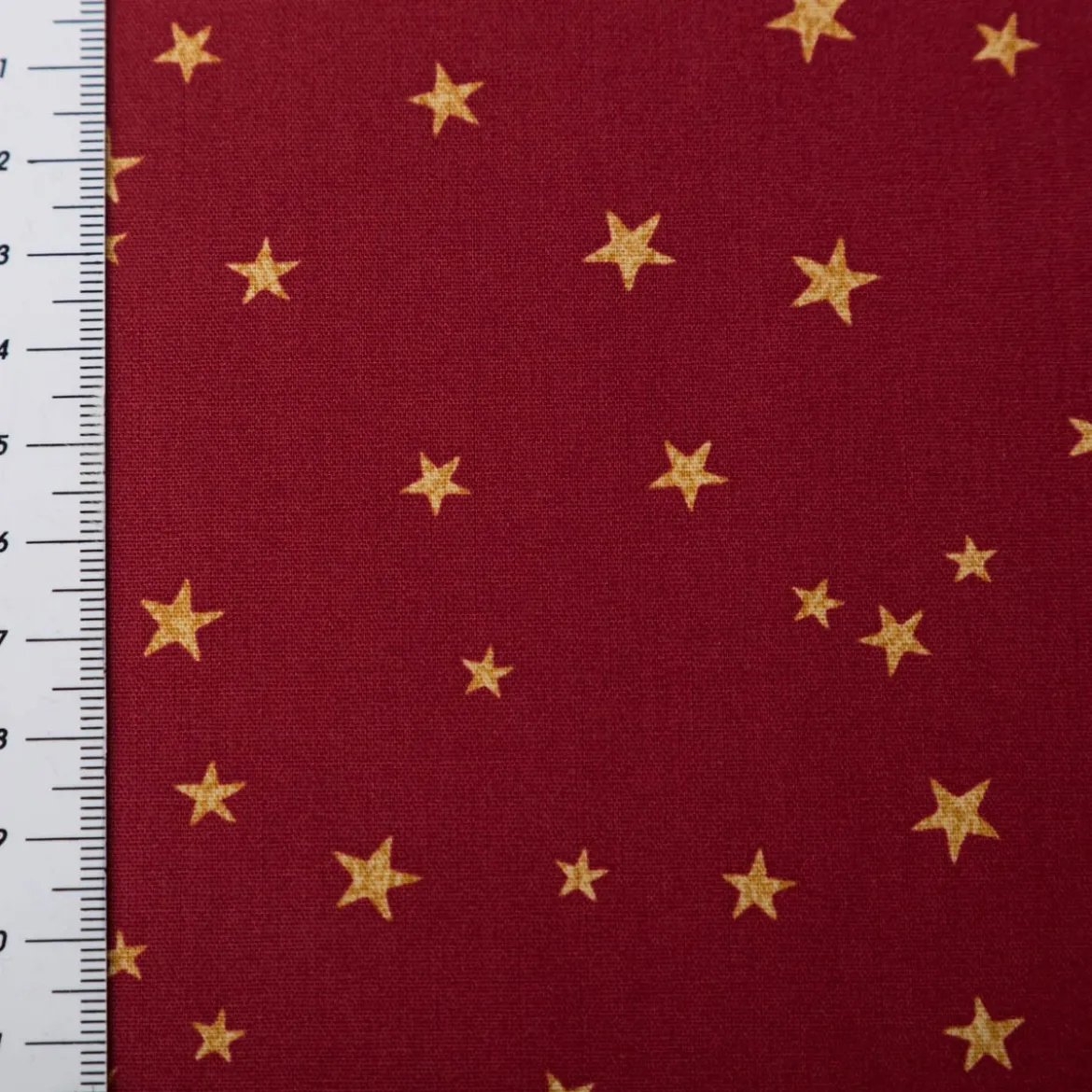Baumwollstoff Webware Weihnachten Sterne bordeaux rot goldfarbig 1,45m Breite