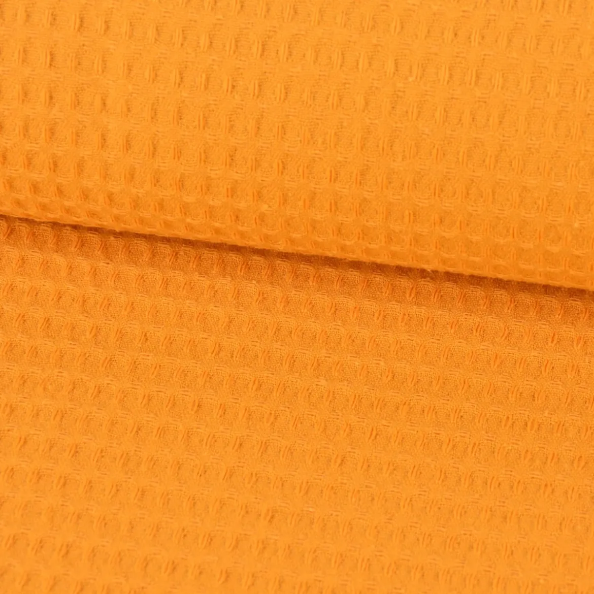 Bekleidungsstoff Waffelpique Baumwolle uni ocker gelb 1,45m Breite