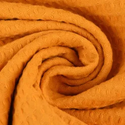 Bekleidungsstoff Waffelpique Baumwolle uni ocker gelb 1,45m Breite
