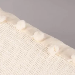 Deko Kissen einfarbig strukturiert mit Pompons ecru 30x50cm