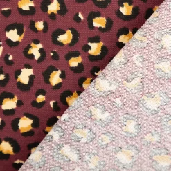 Dekostoff Halbpanama Leomuster Leoprint weinrot gold 1,40m Breite