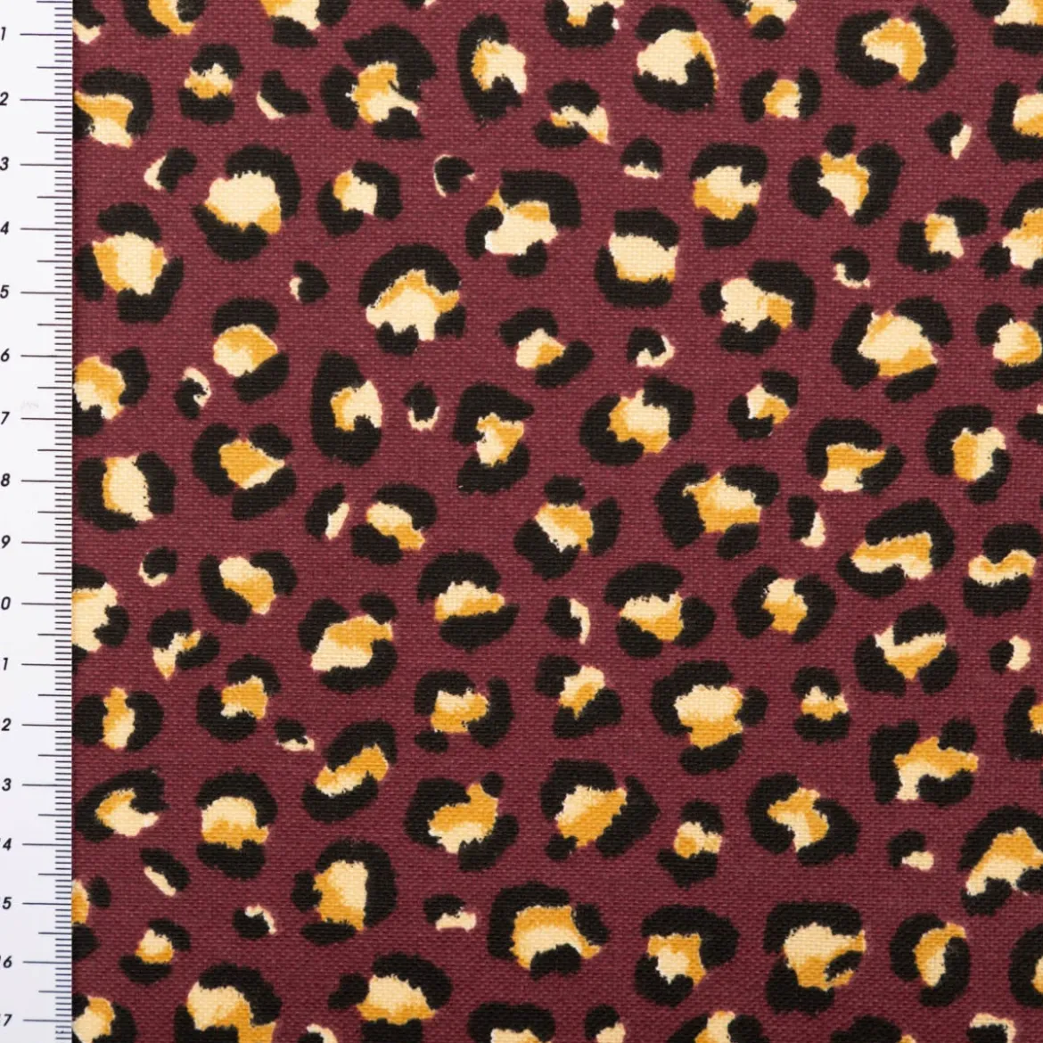 Dekostoff Halbpanama Leomuster Leoprint weinrot gold 1,40m Breite