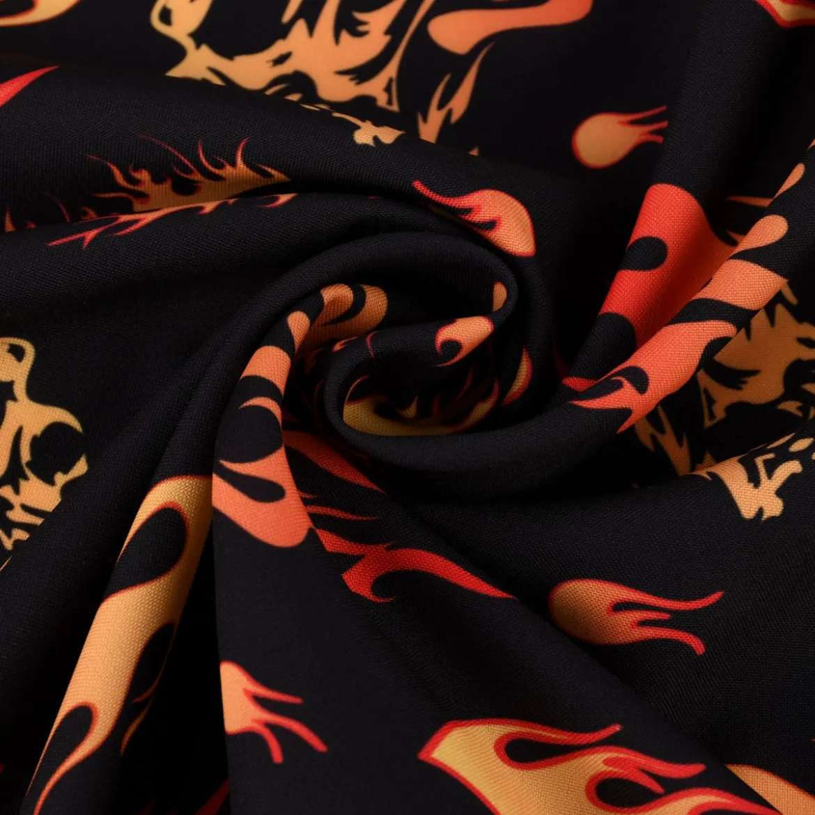 Faschingsstoff Polyester Totenköpfe Flammen schwarz orange 1,5m Breite