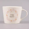 Grafik Werkstatt Goldtasse Frohe Ostern Blumenkranz weiß pastell goldfarbig 420ml