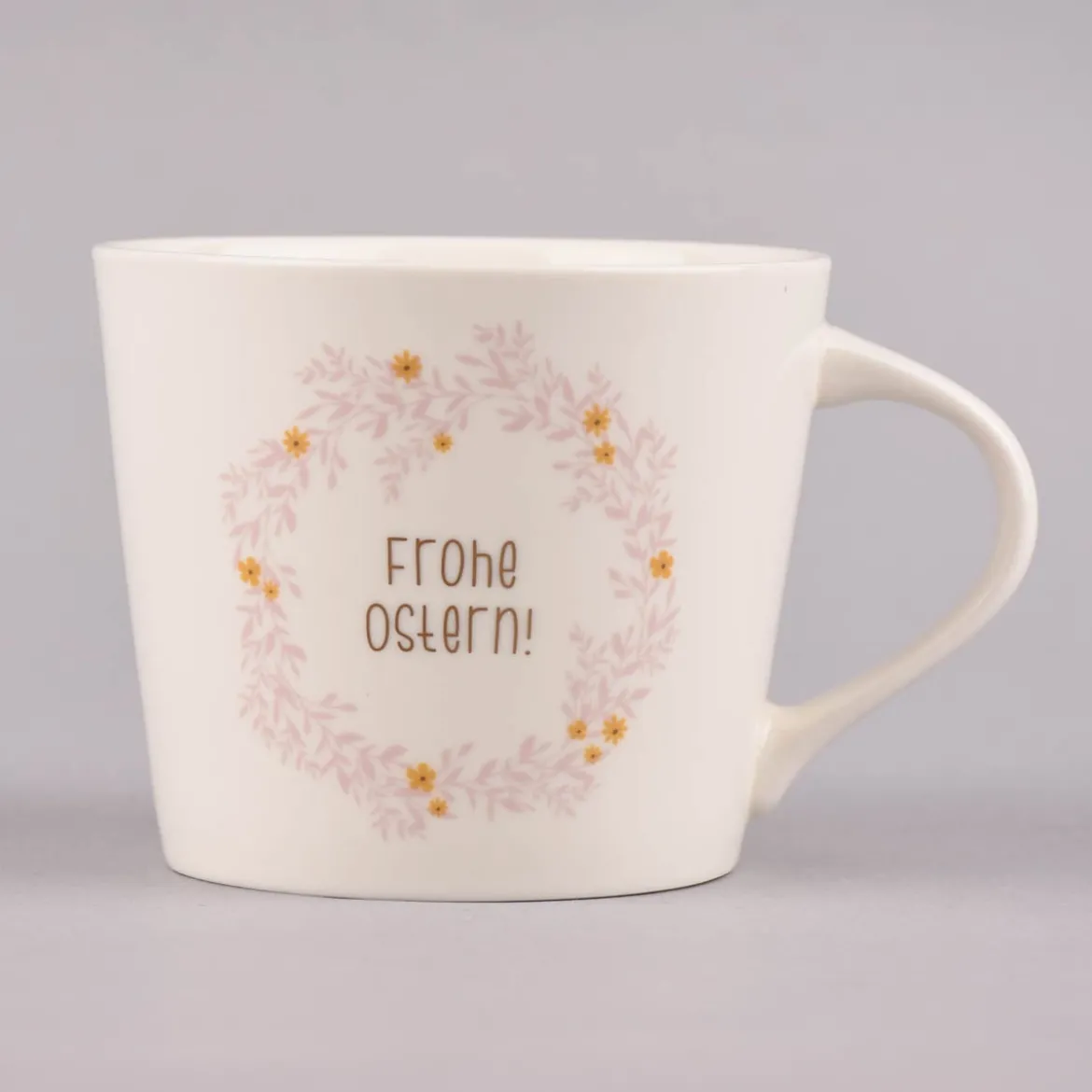 Grafik Werkstatt Goldtasse Frohe Ostern Blumenkranz weiß pastell goldfarbig 420ml