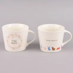 Grafik Werkstatt Goldtasse Frohe Ostern Blumenkranz weiß pastell goldfarbig 420ml