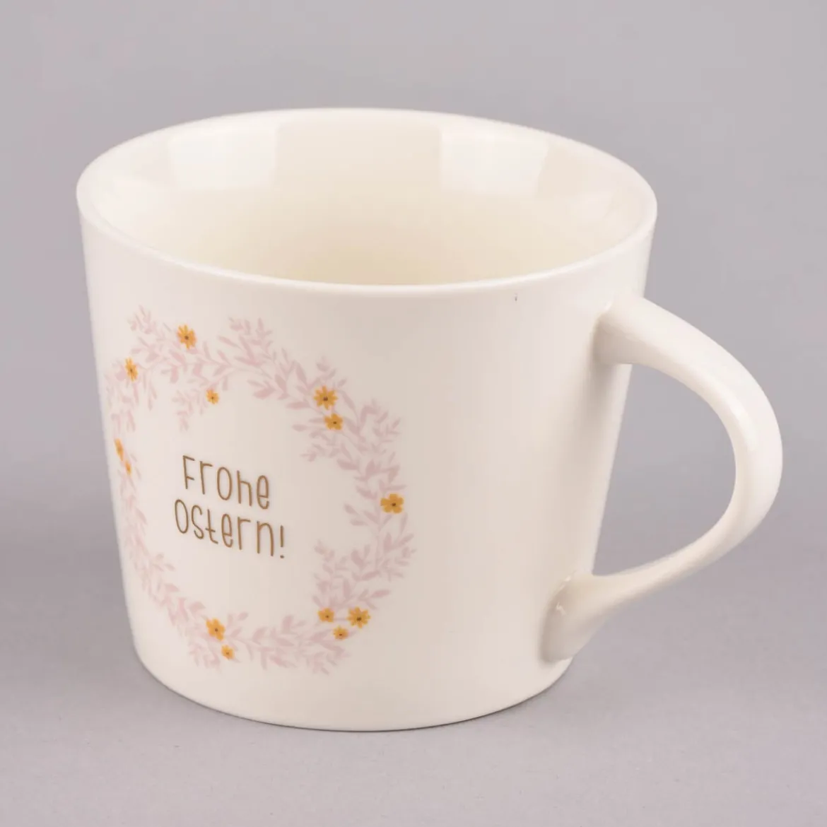 Grafik Werkstatt Goldtasse Frohe Ostern Blumenkranz weiß pastell goldfarbig 420ml