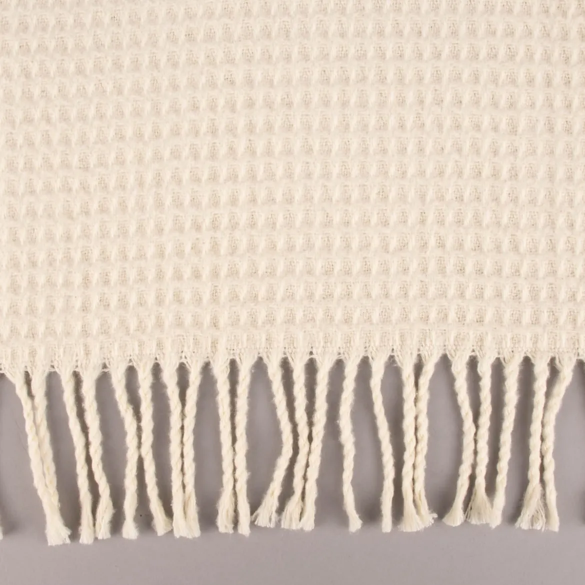 Kuscheldecke mit Waffelstruktur und Fransen creme 150x200cm
