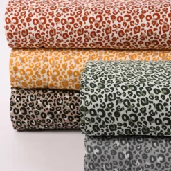 Musselin Stoff Baumwolle glatt Leopardenmuster weiß beige ocker 1,35m Breite