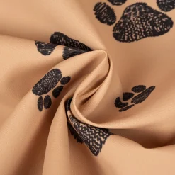 Outdoorstoff polsterfähig Pawprints Hundepfoten beige schwarz 1,60m Breite