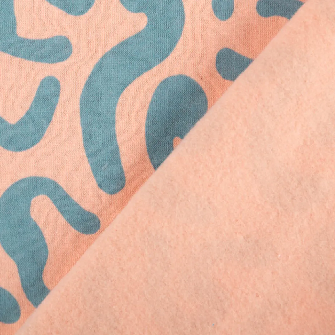 Sweatstoff aus Baumwolle abstrakt peach 1,48m Breite