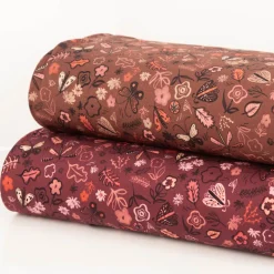 Sweatstoff aus Baumwolle Blumen Schmetterlinge Digitaldruck bordeaux 1,48m Breite