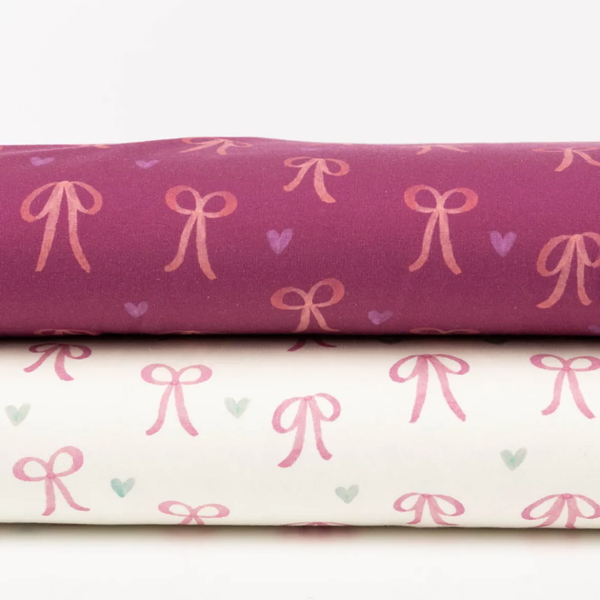 Sweatstoff aus Baumwolle Digitaldruck Schleifen fuchsia 1,50m Breite