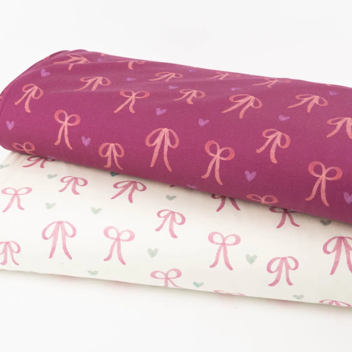 Sweatstoff aus Baumwolle Digitaldruck Schleifen fuchsia 1,50m Breite