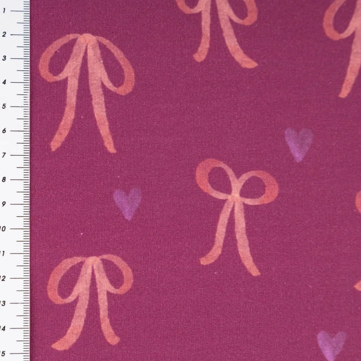 Sweatstoff aus Baumwolle Digitaldruck Schleifen fuchsia 1,50m Breite
