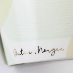 Tasse mit Goldveredelung Guten Morgen weiß grün gold 420ml von Grafik Werkstatt