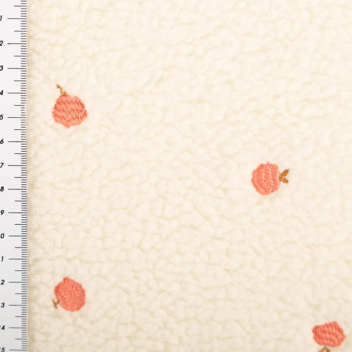 Teddystoff Boucle Pfirsich Stickerei ecru orange 140cm Breite