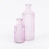 Vase Flaschenform zylinderförmig mit geriffelter Oberfläche transparent lila aus Glas groß oder klein